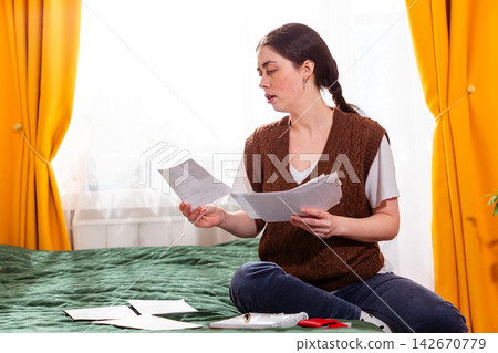 Female managing personal budget and structuring financial strategies for wealth growth. concept of financial awareness and economy. Mid shot Female managing personal budget and structuring financial strategies for wealth growth. concept of financial awareness and economy. Mid shot 142670779
