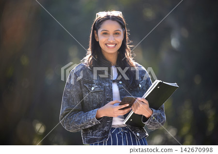 Happy, woman or student in nature with smartphone and books for commute to college campus. Smile, female person and mobile walking with notebook for travel, learning and university education Happy, woman or student in nature with smartphone and books for commute to college campus. Smile, female person and mobile walking with notebook for travel, learning and university education 142670998