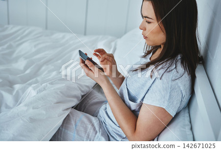 Phone, search or girl relax in bed for social media, chat or web communication at home. Smartphone, app or woman in bedroom for online, sign up or survey for hotel, hospitality or customer experience 142671025