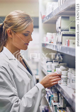 Pharmacist, choice and medicine on shelf in store with drugs, pills or search inventory. Pharmacy, woman and reading label on supplements box or shop a sale of medical product for healing healthcare Pharmacist, choice and medicine on shelf in store with drugs, pills or search inventory. Pharmacy, woman and reading label on supplements box or shop a sale of medical product for healing healthcare 142671123
