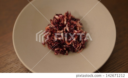 Marinated radicchio served in a chic gray dish. Marinated radicchio served in a chic gray dish. 142671212