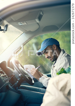 Delivery man, checklist and writing in van for logistics and schedule or updates for courier service or quality control. Person, clipboard and details or records with documents for parcel information Delivery man, checklist and writing in van for logistics and schedule or updates for courier service or quality control. Person, clipboard and details or records with documents for parcel information 142671379