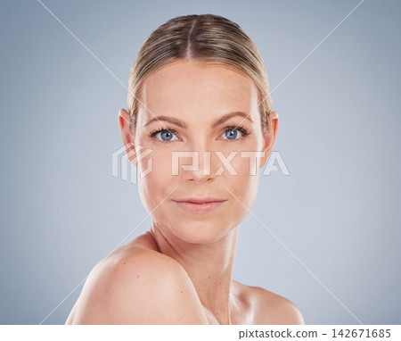 Studio, face and woman in portrait for wellness, healthy skin and skincare with cosmetics. Mockup, female model and natural glow with beauty, treatment results and benefits by gray background 142671685
