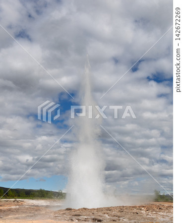 Strokkur geyser erupting in the Haukadalur geothermal area in Iceland, active natural landmark Strokkur geyser erupting in the Haukadalur geothermal area in Iceland, active natural landmark 142672269