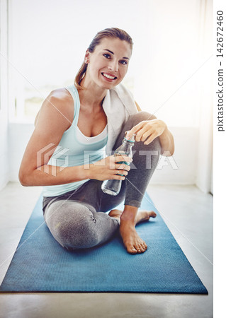 Home, woman and portrait with water after yoga for hydration, wellness and relax in house. Female yogi, thirsty and mineral liquid or H2O bottle for drinking, detox and goal for fitness exercise Home, woman and portrait with water after yoga for hydration, wellness and relax in house. Female yogi, thirsty and mineral liquid or H2O bottle for drinking, detox and goal for fitness exercise 142672460