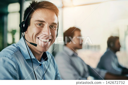 Customer service, smile and portrait of man with headset, coworking space and consulting at help desk. Phone call, conversation and happy advice at callcenter for telemarketing, sales and support. Customer service, smile and portrait of man with headset, coworking space and consulting at help desk. Phone call, conversation and happy advice at callcenter for telemarketing, sales and support. 142672732