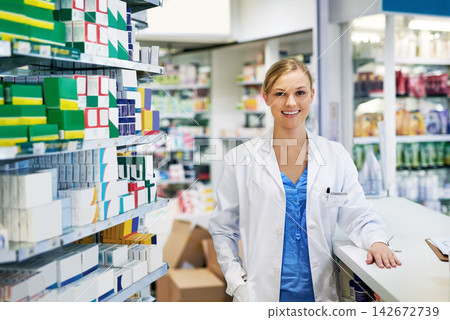 Woman, portrait and pharmacist chemist for helping advice for medication purchase, questions or trust. Female person, face and counter at drug store for antibiotic for flu season, healthcare or shelf Woman, portrait and pharmacist chemist for helping advice for medication purchase, questions or trust. Female person, face and counter at drug store for antibiotic for flu season, healthcare or shelf 142672739