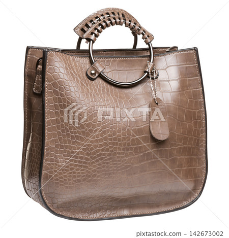 Brown crocodile embossed leather handbag with round metal handle on white background Brown crocodile embossed leather handbag with round metal handle on white background 142673002