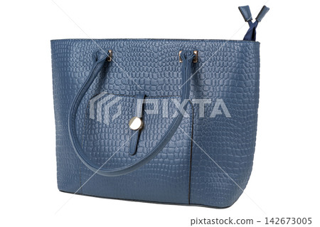 Blue crocodile texture leather tote bag with long shoulder handles on white background Blue crocodile texture leather tote bag with long shoulder handles on white background 142673005