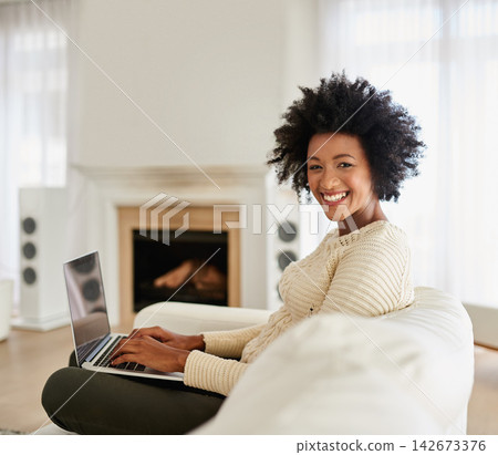 Woman, laptop and happy in home on couch, social media and typing or browse for online shopping or networking. Communication, internet search and reading blog on app, relax and tech in apartment Woman, laptop and happy in home on couch, social media and typing or browse for online shopping or networking. Communication, internet search and reading blog on app, relax and tech in apartment 142673376
