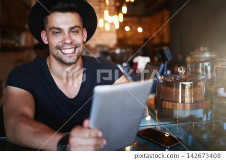 Happy, coffee shop and man in cafe with tablet for small business, stock inventory and store website. Restaurant, hospitality and waiter by counter on digital tech for orders, help and inventory Happy, coffee shop and man in cafe with tablet for small business, stock inventory and store website. Restaurant, hospitality and waiter by counter on digital tech for orders, help and inventory 142673408