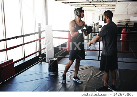 Boxing, men and fitness with training, wellness and motivation with endurance, coaching and challenge. People, trainer and athlete with energy, gloves and progress with practice, support and healthy Boxing, men and fitness with training, wellness and motivation with endurance, coaching and challenge. People, trainer and athlete with energy, gloves and progress with practice, support and healthy 142673803