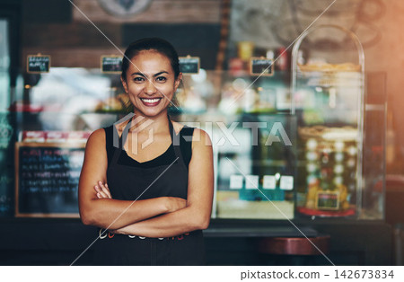 Coffee shop, business owner or portrait of happy woman with arms crossed in startup or restaurant with smile. About us, entrepreneur or proud waitress ready for service, sale or excellence in cafe Coffee shop, business owner or portrait of happy woman with arms crossed in startup or restaurant with smile. About us, entrepreneur or proud waitress ready for service, sale or excellence in cafe 142673834