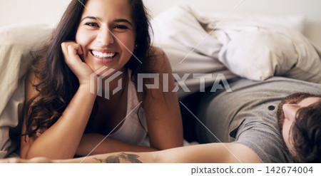 Couple, wake up and portrait of smile, woman and man in weekend, relax and morning in apartment. Home, happiness and love of people in bedroom, rest and comfortable on bed with blanket for break Couple, wake up and portrait of smile, woman and man in weekend, relax and morning in apartment. Home, happiness and love of people in bedroom, rest and comfortable on bed with blanket for break 142674004