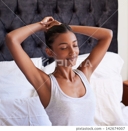 Stretching, wake up and woman in bed with zen, satisfaction and morning at home for peace. Arms out, energy and awake with wellness, fresh and rest with stress relief and mindfulness for calm Stretching, wake up and woman in bed with zen, satisfaction and morning at home for peace. Arms out, energy and awake with wellness, fresh and rest with stress relief and mindfulness for calm 142674007