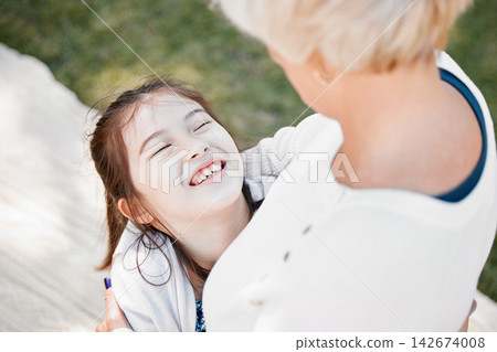 Young girl, happy and hug grandmother in nature for love, affection and excited outdoors. Child, grandma and squeeze for care, compassion and support in park for bonding, relationship and picnic Young girl, happy and hug grandmother in nature for love, affection and excited outdoors. Child, grandma and squeeze for care, compassion and support in park for bonding, relationship and picnic 142674008