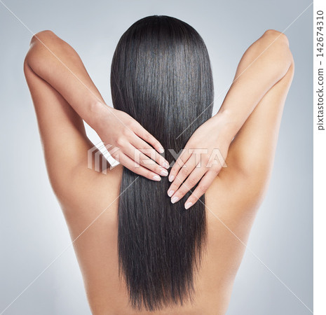 Hair, back and girl hands in studio with wellness, cosmetics and shampoo treatment, shine or results on grey background. Haircare, beauty and behind woman model with texture, glow and growth progress Hair, back and girl hands in studio with wellness, cosmetics and shampoo treatment, shine or results on grey background. Haircare, beauty and behind woman model with texture, glow and growth progress 142674310