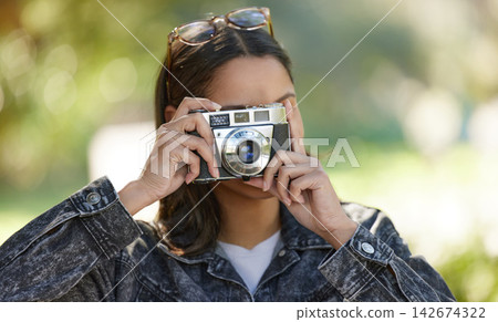 Outdoor, camera and woman with nature, sunshine and adventure with memory, travel and student. Campus, university or girl with photography, journey or explore with project for environment or picture 142674322