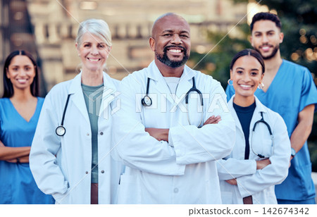 Team, doctors and outdoor portrait of collaboration, diversity and confidence in healthcare management. Together, unity and proud of medical service, support and trust in solidarity or commitment Team, doctors and outdoor portrait of collaboration, diversity and confidence in healthcare management. Together, unity and proud of medical service, support and trust in solidarity or commitment 142674342