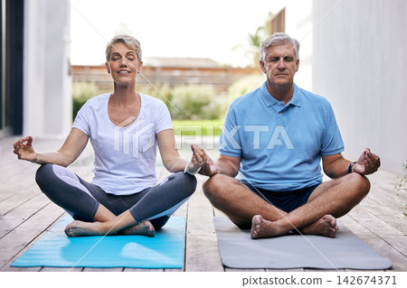 Meditation, calm and senior couple in garden for mindful, body and spiritual wellness at home. Relax, health and elderly man and woman in retirement with yoga exercise for balance outdoor at house. Meditation, calm and senior couple in garden for mindful, body and spiritual wellness at home. Relax, health and elderly man and woman in retirement with yoga exercise for balance outdoor at house. 142674371