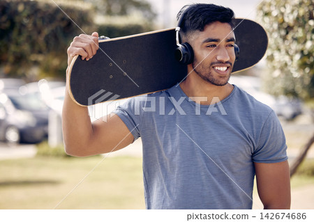 Man, headphones and skateboard at outdoor park with relax thinking or music playlist, exercise or hobby. Male person, smile and streaming podcast for learning skill or fun workout, online or training Man, headphones and skateboard at outdoor park with relax thinking or music playlist, exercise or hobby. Male person, smile and streaming podcast for learning skill or fun workout, online or training 142674686
