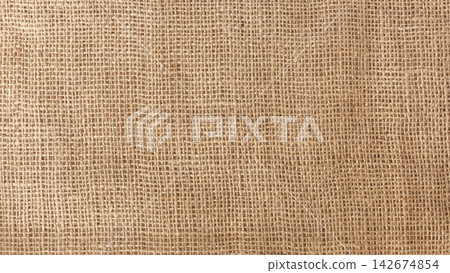 Coarse brown canvas background with a pronounced mesh structure Coarse brown canvas background with a pronounced mesh structure 142674854