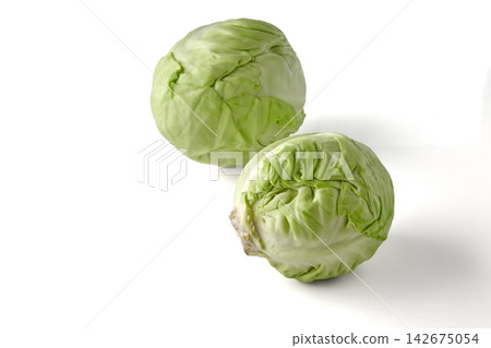 Two Fresh Green Cabbages Isolated on White Background Two Fresh Green Cabbages Isolated on White Background 142675054