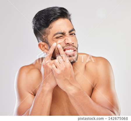 Pimple, hands and portrait of man in studio for skincare, skin dermatology or facial outbreak with white background. Body, upset and male model with acne for grooming, beauty wellness or blackhead 142675068