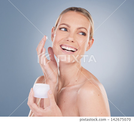 Woman, face cream and jar in studio for beauty with application, cosmetics and idea by mockup. Female model, thinking and skincare treatment with lotion, moisturizer and results by gray background Woman, face cream and jar in studio for beauty with application, cosmetics and idea by mockup. Female model, thinking and skincare treatment with lotion, moisturizer and results by gray background 142675070