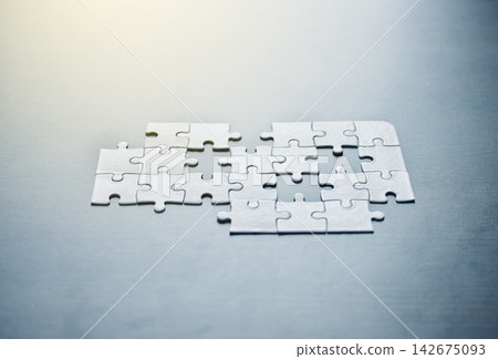 Puzzle, desk and game for problem solving with team building, brainstorming or collaboration. Planning, thinking and jigsaw on table for solution, strategy or brain development with mockup space. Puzzle, desk and game for problem solving with team building, brainstorming or collaboration. Planning, thinking and jigsaw on table for solution, strategy or brain development with mockup space. 142675093