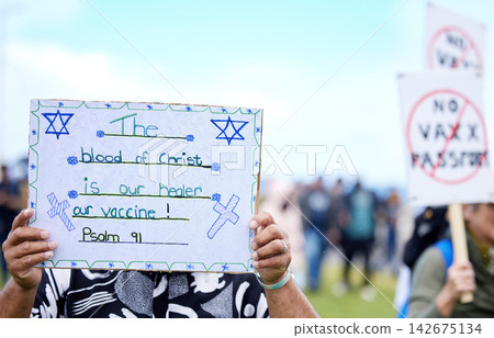 Passport, poster and protest of vaccine, people and community with sign against government and campaign. Society, activist and rally to stop paper card for travel, human rights and Covid 19 in USA Passport, poster and protest of vaccine, people and community with sign against government and campaign. Society, activist and rally to stop paper card for travel, human rights and Covid 19 in USA 142675134