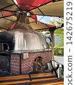 Wood-fired pizza oven 142675219