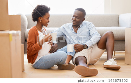 African, couple and boxes with tea in lounge for moving, house and relocation on couch in living room. Woman, man and pregnancy as happy in packing for apartment, new home or property as young people African, couple and boxes with tea in lounge for moving, house and relocation on couch in living room. Woman, man and pregnancy as happy in packing for apartment, new home or property as young people 142675302