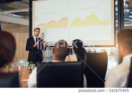 Businessman, presentation and audience meeting with charts in boardroom or financial analysis, graphs or report. Colleagues, screen and review of stock market for project budget, investment or growth Businessman, presentation and audience meeting with charts in boardroom or financial analysis, graphs or report. Colleagues, screen and review of stock market for project budget, investment or growth 142675405