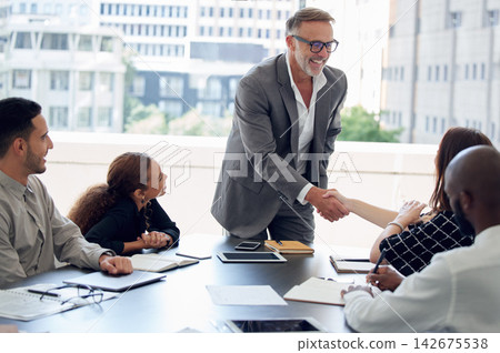 Business people, handshake and teamwork in boardroom, deal and thank you for onboarding in office. Employees, meeting and congratulations for hire or promotion, introduction and agreement on offer Business people, handshake and teamwork in boardroom, deal and thank you for onboarding in office. Employees, meeting and congratulations for hire or promotion, introduction and agreement on offer 142675538