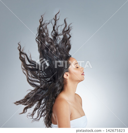 Woman, health and flip or hair care in studio, beauty and texture shampoo on white background. Female person, cosmetic and conditioner treatment for hairstyle, confident and profile for dermatology Woman, health and flip or hair care in studio, beauty and texture shampoo on white background. Female person, cosmetic and conditioner treatment for hairstyle, confident and profile for dermatology 142675823