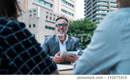 Manager, smile and outside with tablet for meeting at table in company with team for strategy. Lawyer, attorney and law firm on balcony with happiness for case on rooftop for view in the Netherlands. Manager, smile and outside with tablet for meeting at table in company with team for strategy. Lawyer, attorney and law firm on balcony with happiness for case on rooftop for view in the Netherlands. 142675858