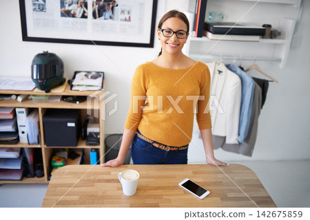 Office, project and portrait of woman in fashion, creative workplace and confident business owner. Happy, person and productivity in workshop with retail clothes for dropshipping and ecommerce Office, project and portrait of woman in fashion, creative workplace and confident business owner. Happy, person and productivity in workshop with retail clothes for dropshipping and ecommerce 142675859