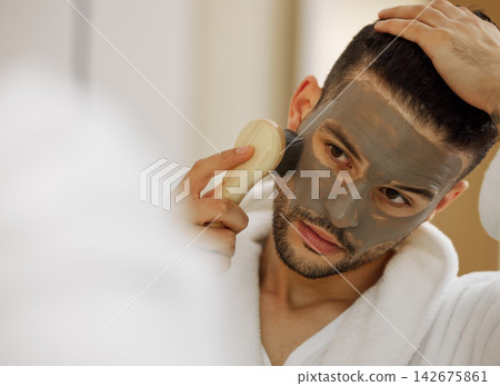 Skincare, face mask and man in home with mirror for vegan beauty, skin glow and dermatology. Brush, facial product and male person in house for acne with self care and cosmetics with hyaluronic acid Skincare, face mask and man in home with mirror for vegan beauty, skin glow and dermatology. Brush, facial product and male person in house for acne with self care and cosmetics with hyaluronic acid 142675861