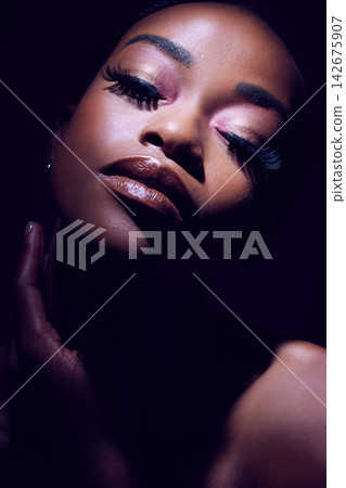 Beauty, face and glamour with black woman in makeup on dark background for cosmetics or elegance. Eyeshadow, lipstick and mascara with bold model person in studio for african pride or art deco 142675907