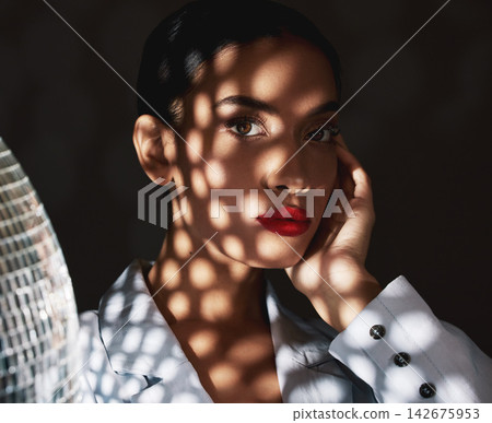 Confident, portrait and woman with makeup in darkness of room, red lipstick and elegant with beauty. Studio background, cosmetics and aesthetic for person, girl and relax of model and wall of glamour 142675953