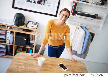 Office, portrait and woman with project in fashion, creative workplace and confident business owner. Happy, person and productivity in workshop with retail clothes for dropshipping and ecommerce Office, portrait and woman with project in fashion, creative workplace and confident business owner. Happy, person and productivity in workshop with retail clothes for dropshipping and ecommerce 142675978