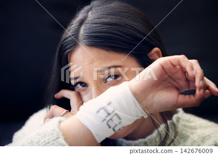 Depression, woman and crying for help, suicide and mental health support with self harm idea in portrait. Girl, bandage and wrist injury or accident for pain, trauma and anxiety with frustrated tears Depression, woman and crying for help, suicide and mental health support with self harm idea in portrait. Girl, bandage and wrist injury or accident for pain, trauma and anxiety with frustrated tears 142676009