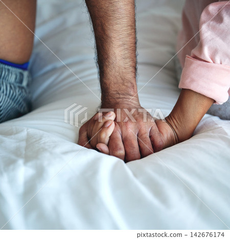 Couple, holding hands or closeup of support in home with empathy, compassion or connection on bed. Spiritual, people or praying in bedroom with thankful, worship or faith with comfort or appreciation Couple, holding hands or closeup of support in home with empathy, compassion or connection on bed. Spiritual, people or praying in bedroom with thankful, worship or faith with comfort or appreciation 142676174