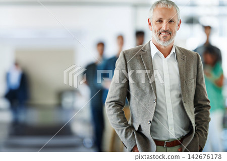 Smile, portrait and mature businessman in office with team for leadership, confident and positive attitude. Happy, pride and lawyer manager with employees for legal case collaboration at workplace. 142676178