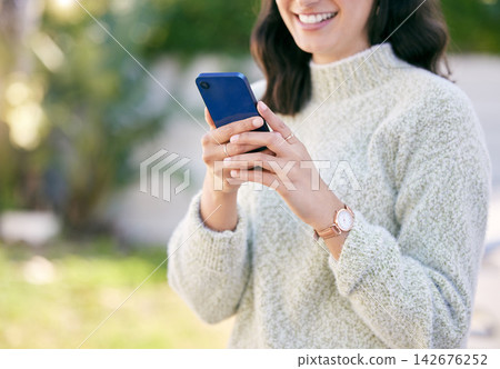 Hands, phone or girl in park to chat on social media, internet post or news website notification in nature. Outdoor, smile or happy woman of texting, networking or typing online on blog or mobile app 142676252