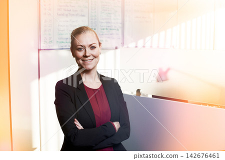 Business woman, portrait and confident for agency in office, smile and employee for company growth. Female person, arms crossed and proud professional at law firm, career opportunity and entrepreneur Business woman, portrait and confident for agency in office, smile and employee for company growth. Female person, arms crossed and proud professional at law firm, career opportunity and entrepreneur 142676461