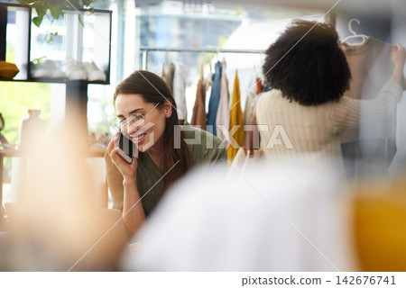 Phone call, fashion and business woman in store for online order, communication and talking to client. Startup, retail boutique and worker on smartphone for conversation, contact and clothing stock Phone call, fashion and business woman in store for online order, communication and talking to client. Startup, retail boutique and worker on smartphone for conversation, contact and clothing stock 142676741