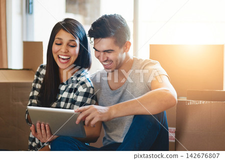 Couple, tablet and boxes on floor in new home with reading, memory or meme on social media with property. People, man and woman on digital touchscreen, cardboard and package for real estate in house Couple, tablet and boxes on floor in new home with reading, memory or meme on social media with property. People, man and woman on digital touchscreen, cardboard and package for real estate in house 142676807
