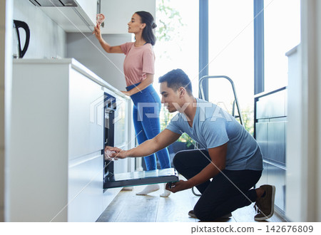Couple, house and spring cleaning in kitchen for teamwork with love, bonding and health with routine. Weekend, people and apartment for safety from bacteria with hygiene for fresh with care in Sweden 142676809